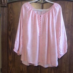 Peach and white pull over top.